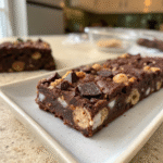 Dairy free rocky road ice cream bar with chocolate chunks and marshmallows.