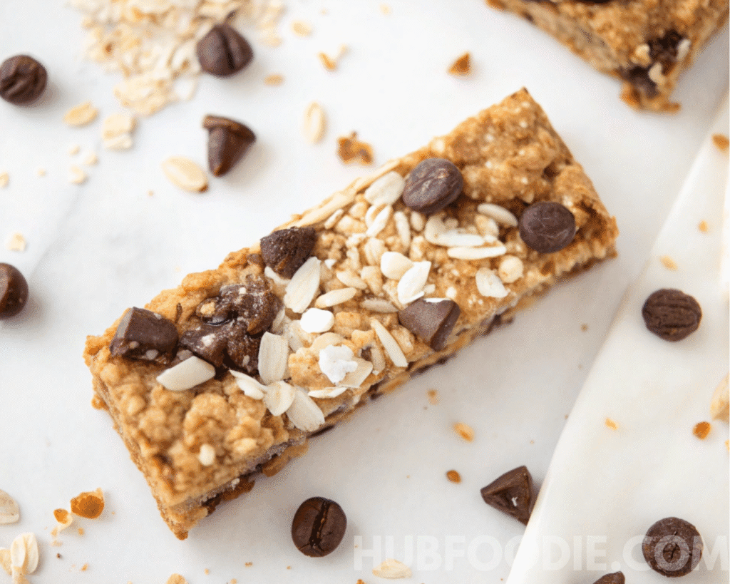 Nut free granola bars recipe final step with oats and chocolate chips on top.