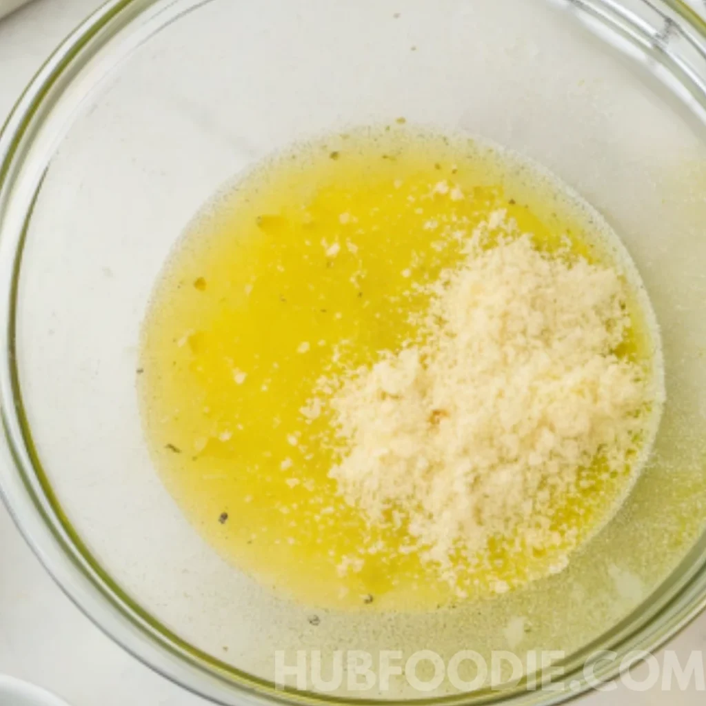 Gnocchi Pasta Salad 38 Glass bowl with olive oil, lemon juice, and grated parmesan cheese.