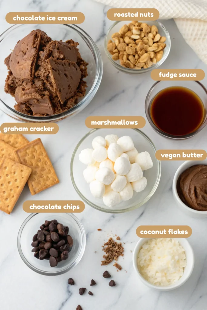 Rocky Road Ice Cream Cake 10 Ingredients for rocky road ice cream cake including chocolate ice cream, marshmallows, nuts, and fudge sauce