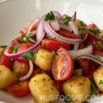 Crispy gnocchi with cherry tomatoes, red onions, and fresh herbs.